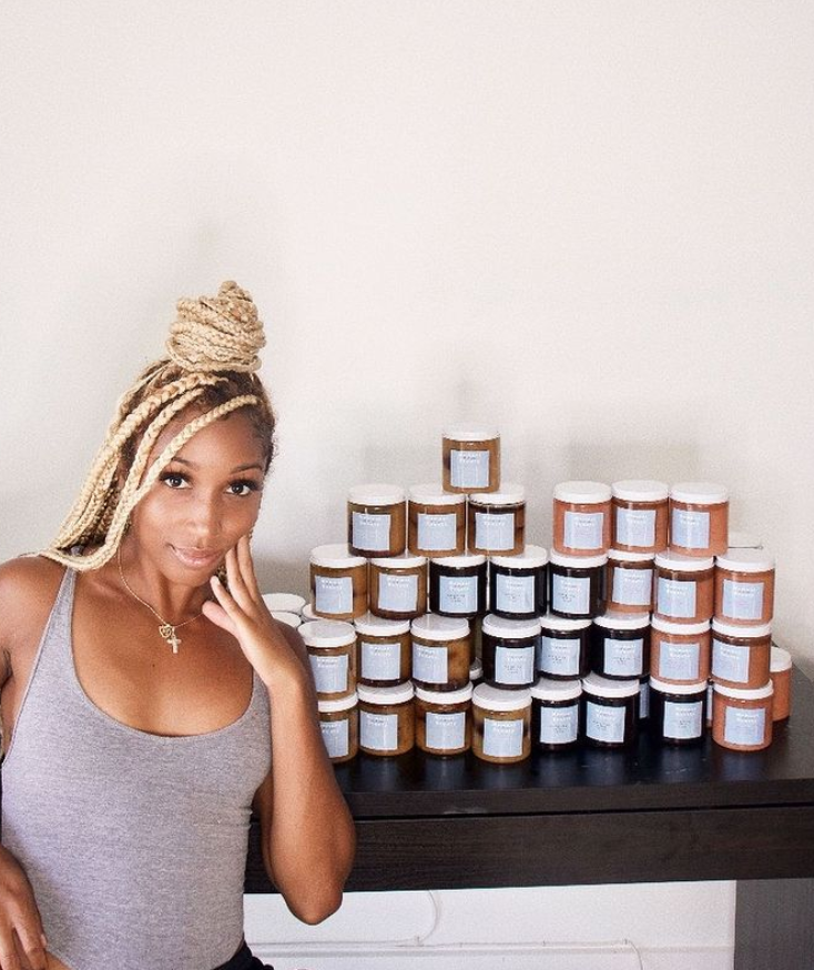Maya Stephens next to a table of scrubs.